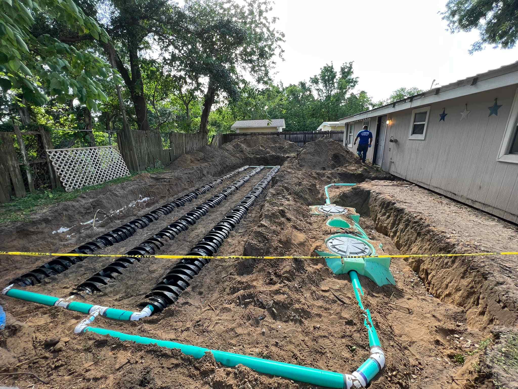 Victor, a plumbing expert, is installing a water line in a backyard.